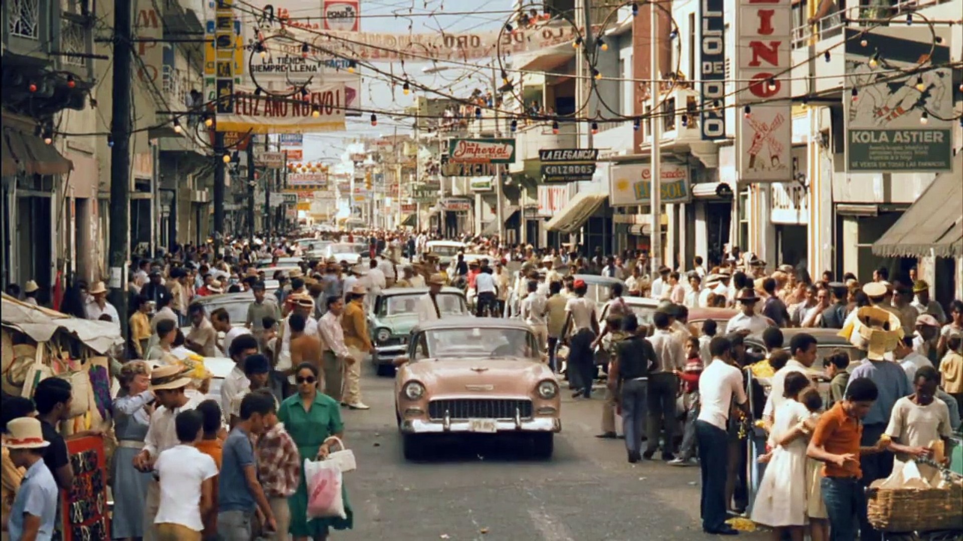 Michael Corleone walking through a crowded Havana street during the Cuban Revolution in The Godfather Part II